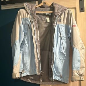 North face summit series jacket. Women’s medium. Small tear bottom right.
